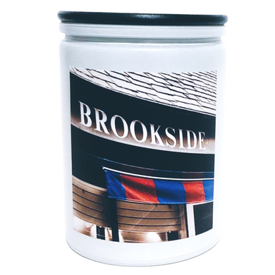 KCMOCO. Candles Brookside Blvd. Candle in KC Collection Jar: White glass jar with photo label with photo of Brookside Shops Awning, with black bamboo lid.