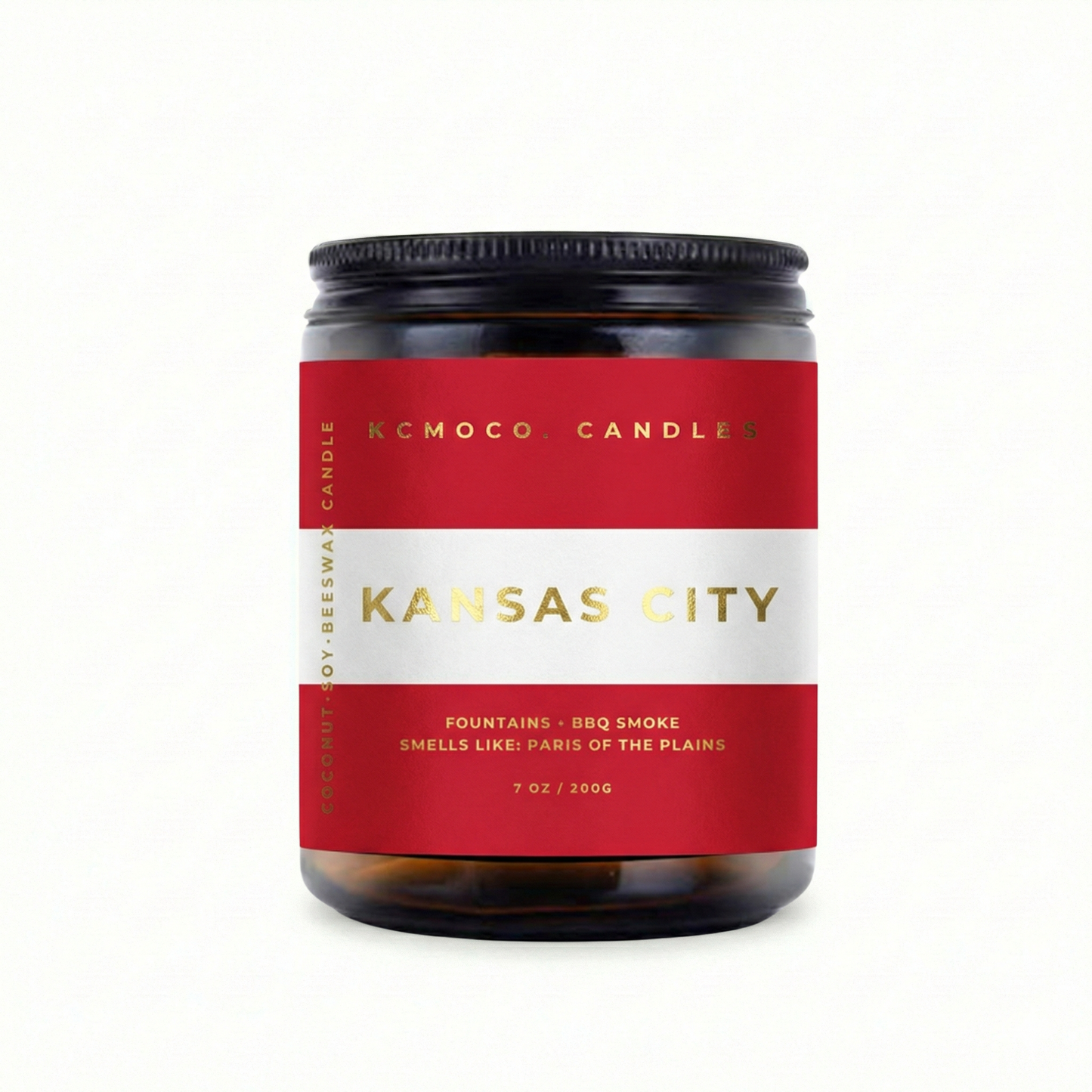 red white and gold Austrian Flag inspired label on candle reading "Kansas City" with black lid on white background