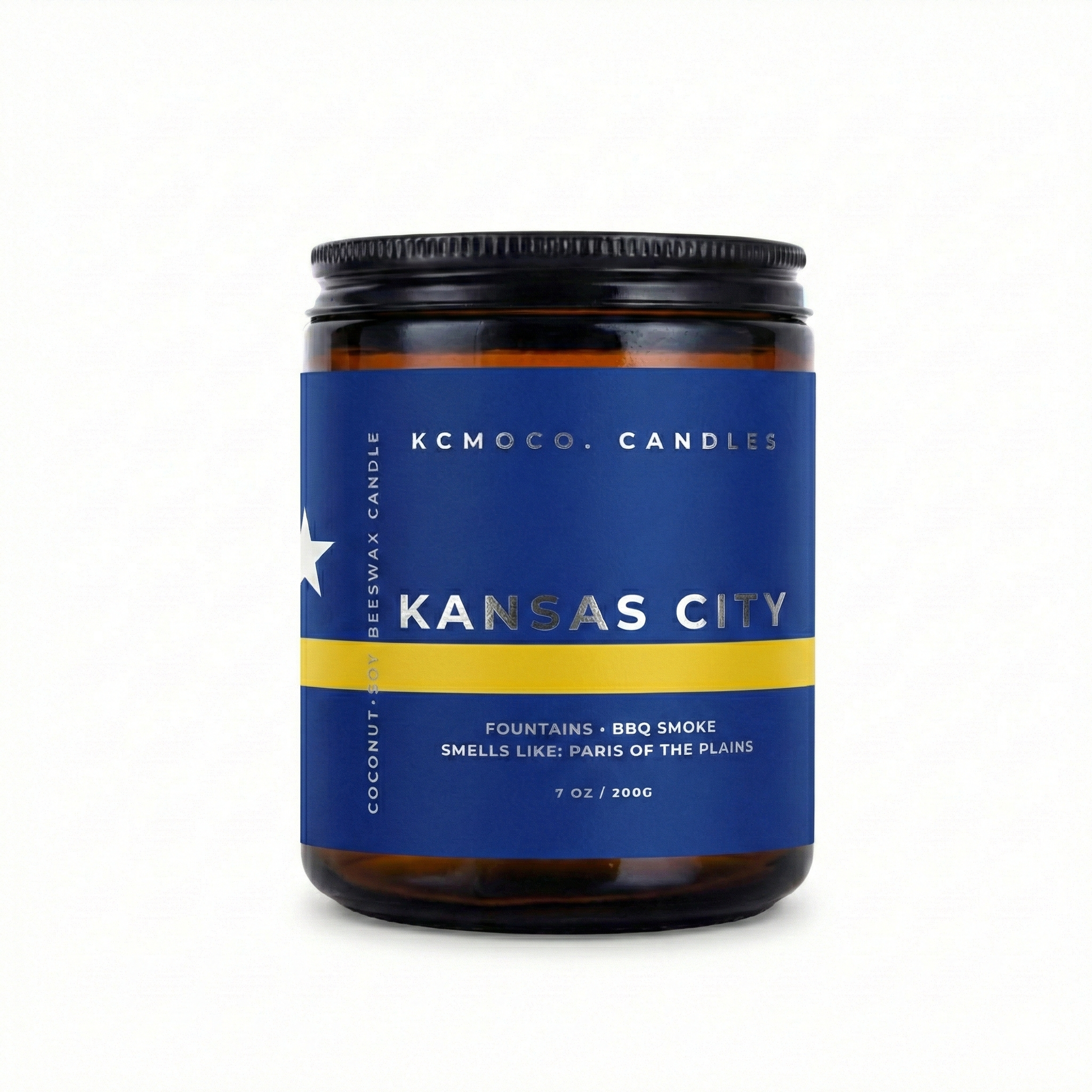 blue yellow white and silver Curacao Flag inspired label on candle reading "Kansas City" with black lid on white background