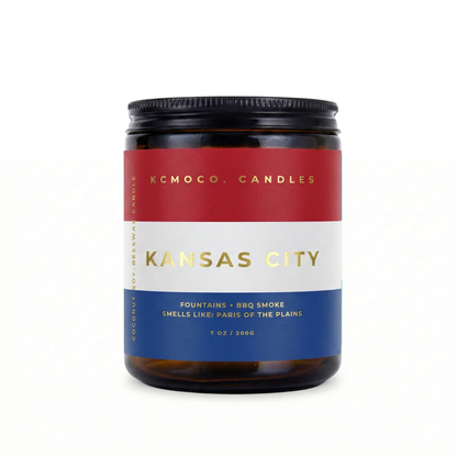 red blue white and gold Netherlands Flag inspired label on candle reading "Kansas City" with black lid on white background