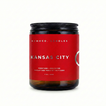 red and silver Tunisia Flag inspired label on candle reading "Kansas City" with black lid on white background