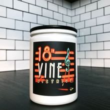 Load image into Gallery viewer, KCMOCO. 18th &amp; Vine Candle in KC Collection Jar: White glass jar with photo label with photo of 18th &amp; Vine neon sign, with black bamboo lid on kitchen cabinet..
