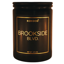 Load image into Gallery viewer, KCMOCO. Candles Brookside Blvd. Candle in Classic Collection Jar: Black glass jar with gold foil label reading &quot;KCMOCO. Brookside Blvd.&quot;, with black bamboo lid.
