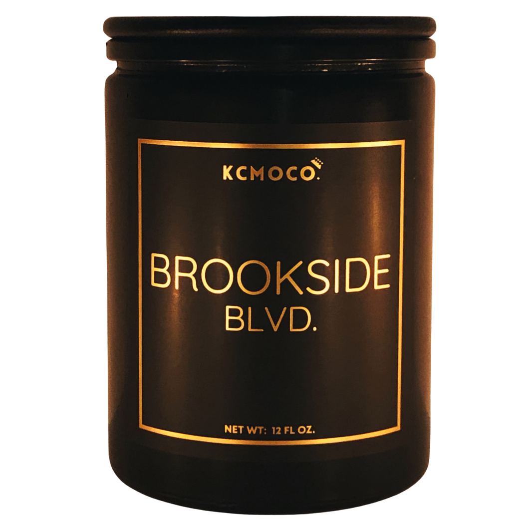 KCMOCO. Candles Brookside Blvd. Candle in Classic Collection Jar: Black glass jar with gold foil label reading 