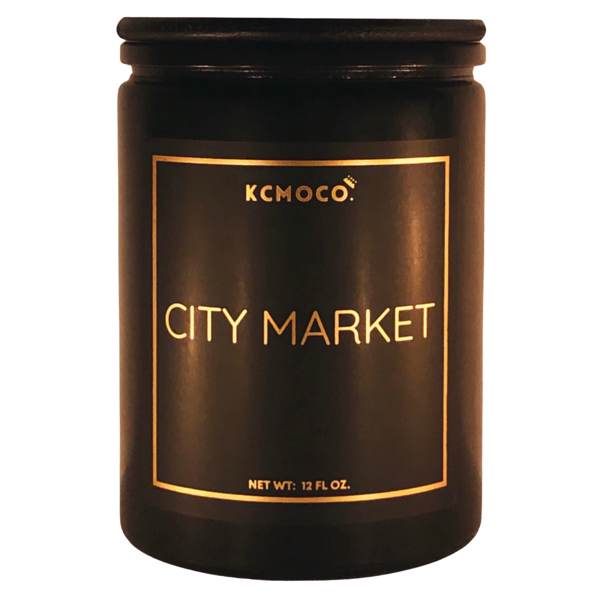 KCMOCO. Candles City Market Candle in Classic Collection Jar: Black glass jar with gold foil label reading "KCMOCO. City Market", with black bamboo lid.