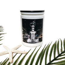 Load image into Gallery viewer, KCMOCO. Fountain City Candle in KC Collection Jar: White glass jar with photo label depicting David Woods Kemper Memorial Fountain aka Muse of the Missouri by Wheeler Williams, with black bamboo lid. Palm leaf and starfish in foreground.
